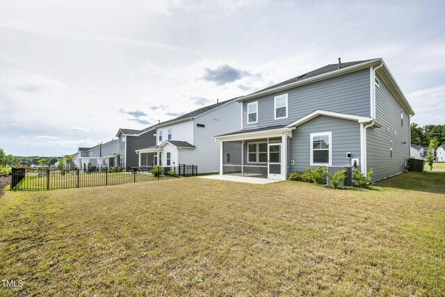 back of property with a sunroom and central air condition unit