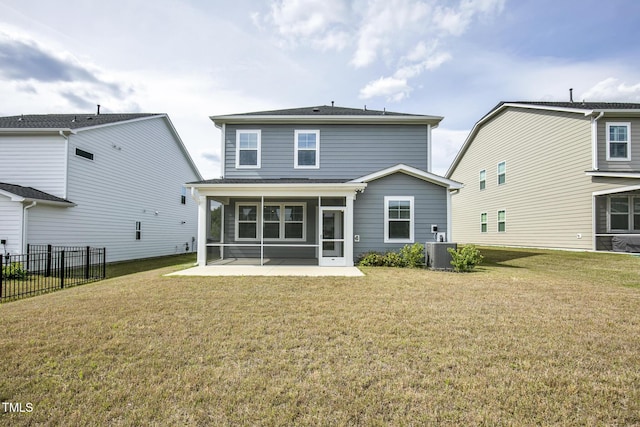 rear view of property featuring a sunroom, cooling unit, a patio, and roof with shingles