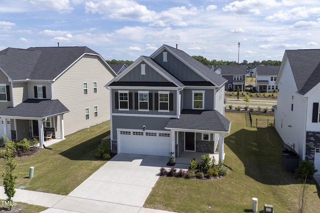view of front of home with board and batten siding, driveway, an attached garage, stone siding, and a residential view