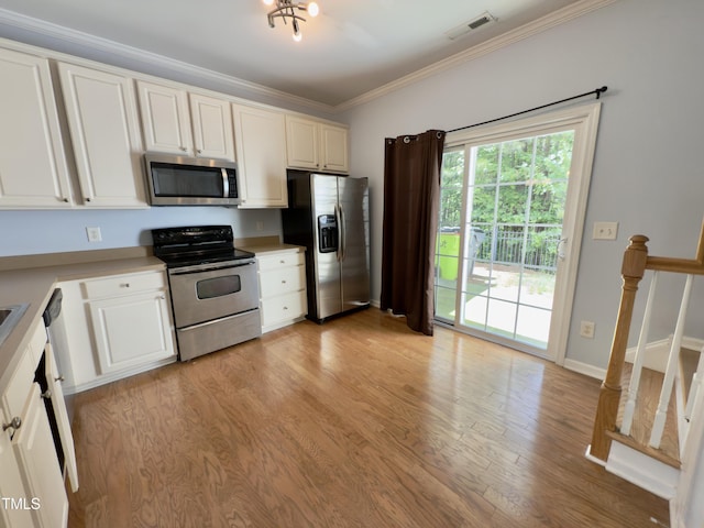 kitchen with stainless steel appliances, light wood-type flooring, white cabinets, crown molding, and light countertops