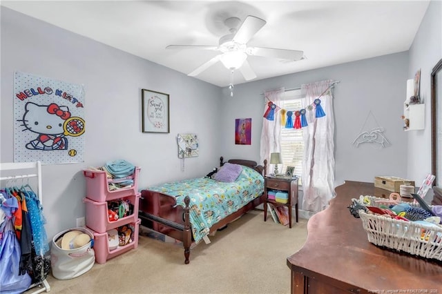 carpeted bedroom with a ceiling fan