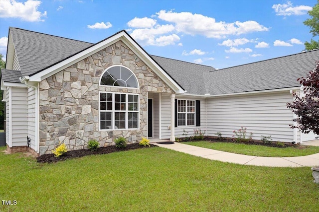 1969 Bowles Ave, Creedmoor, NC 27522 - single story home with stone siding, a front lawn, roof with shingles, and a garage