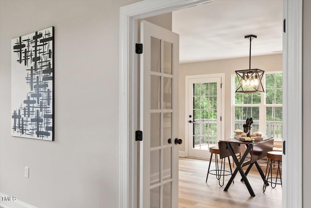 1969 Bowles Ave, Creedmoor, NC 27522 - entryway with light wood-type flooring and a chandelier