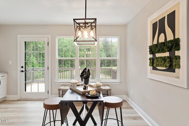 1969 Bowles Ave, Creedmoor, NC 27522 - dining room featuring light wood-type flooring, baseboards, and a chandelier