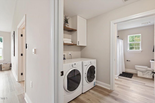 1969 Bowles Ave, Creedmoor, NC 27522 - laundry room featuring washing machine and clothes dryer, light wood-style floors, and baseboards