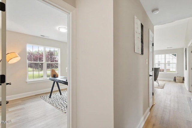 1969 Bowles Ave, Creedmoor, NC 27522 - hallway with light wood-style floors, baseboards, and an office area