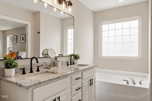 1969 Bowles Ave, Creedmoor, NC 27522 - bathroom with a bath and double vanity