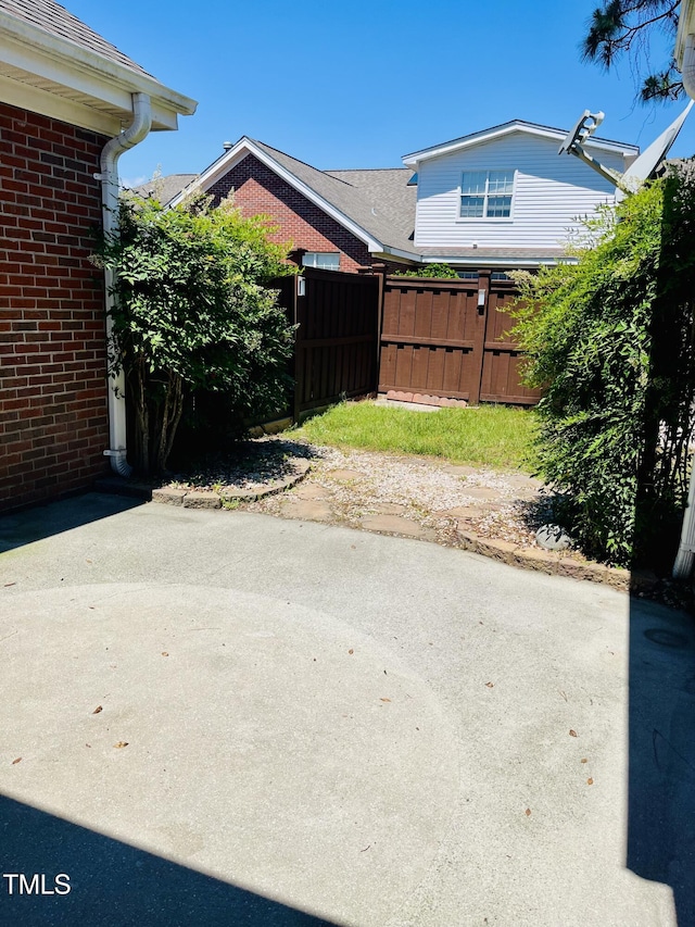 view of yard with a patio and fence