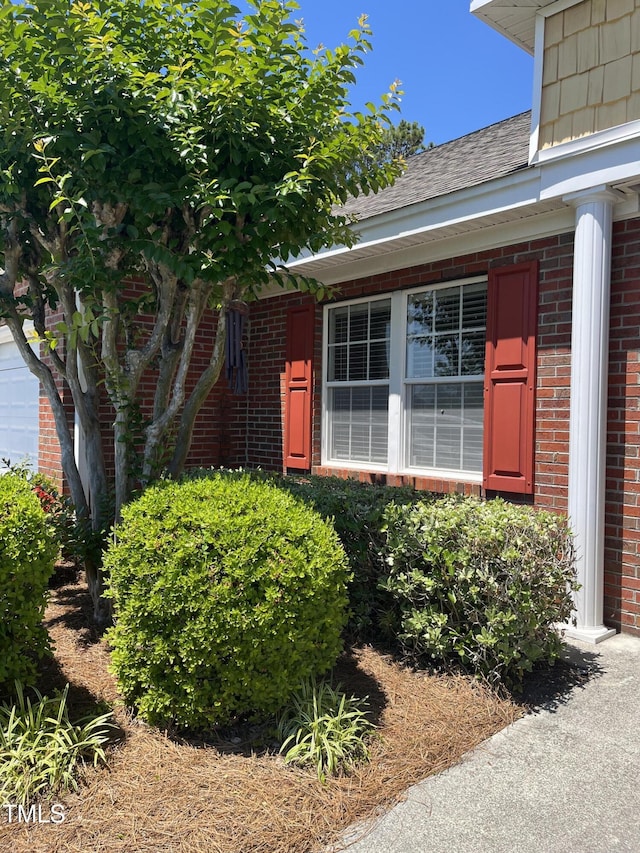 property entrance with brick siding