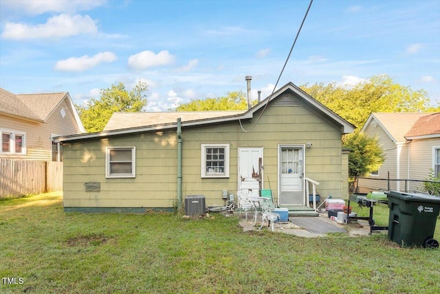 back of house featuring central air condition unit and entry steps