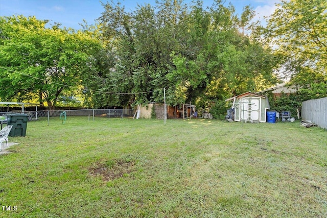 view of yard featuring a storage unit and an outdoor structure