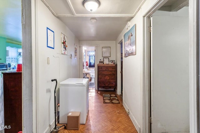 corridor featuring baseboards