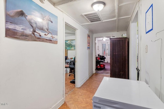 hallway featuring baseboards