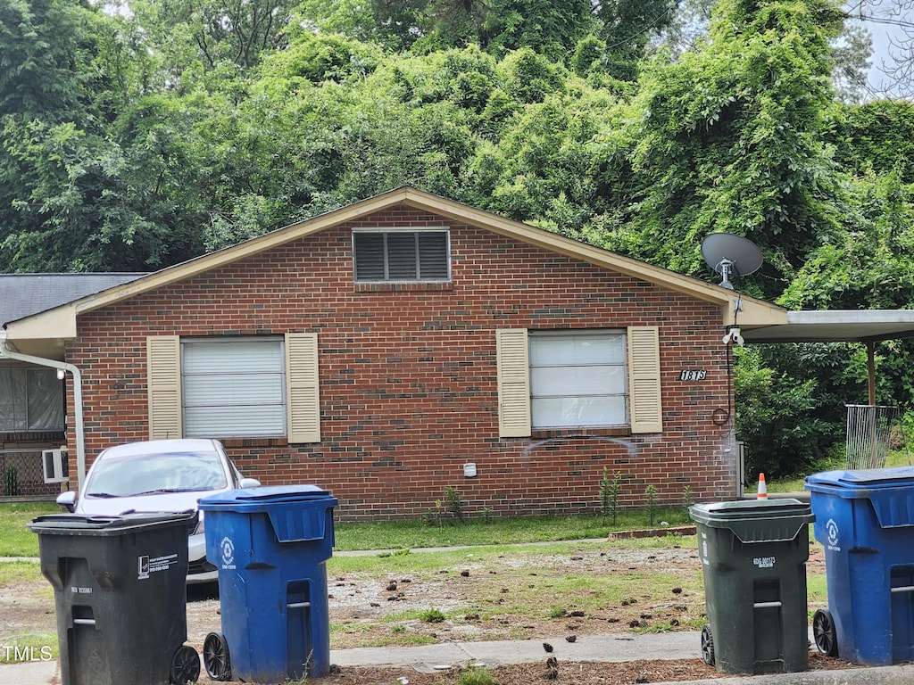 view of home's exterior with brick siding