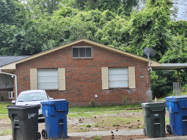 view of home's exterior with brick siding