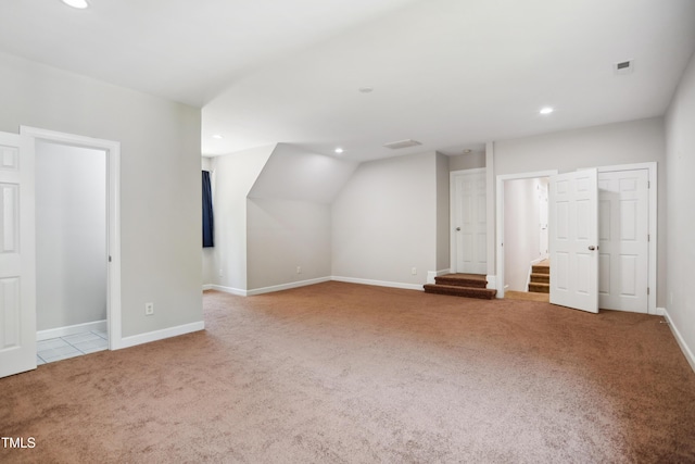 bonus room featuring carpet flooring, recessed lighting, baseboards, and stairway
