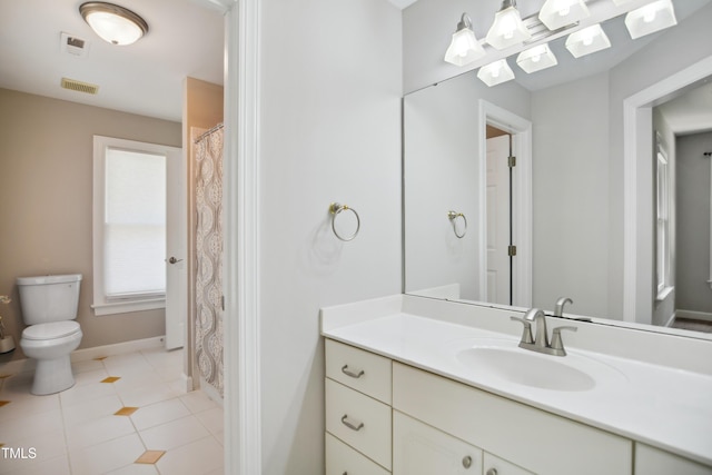 full bath with toilet, tile patterned floors, vanity, and baseboards