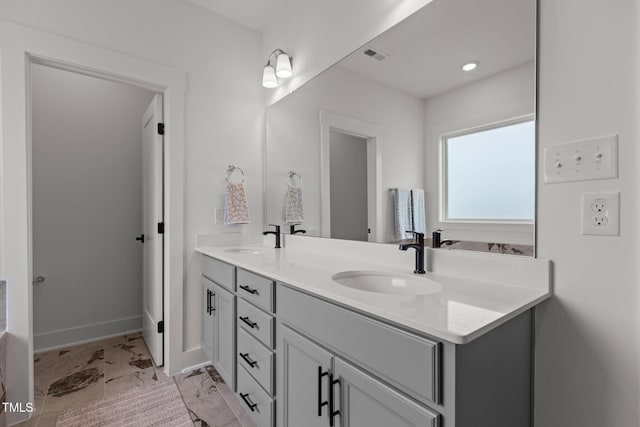 825 Abbyberry Dr, Wake Forest, NC 27587 - bathroom featuring double vanity and baseboards