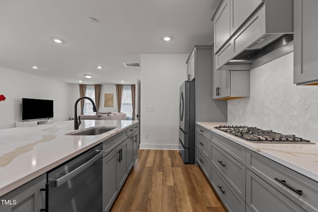 825 Abbyberry Dr, Wake Forest, NC 27587 - kitchen with stainless steel appliances, a sink, gray cabinetry, open floor plan, and recessed lighting