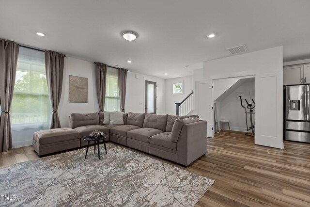 825 Abbyberry Dr, Wake Forest, NC 27587 - living room with wood finished floors, stairs, and recessed lighting