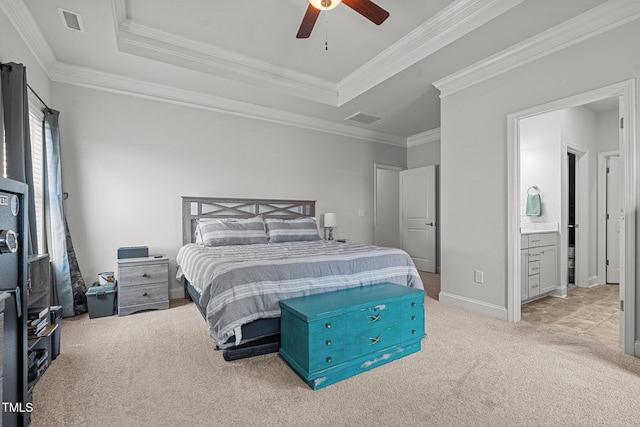bedroom featuring carpet flooring, a raised ceiling, crown molding, baseboards, and ceiling fan