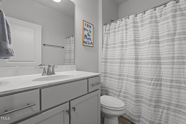 bathroom with vanity and toilet