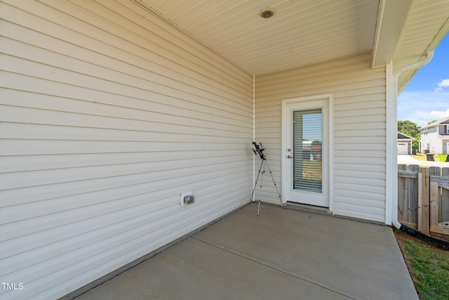 view of patio featuring fence
