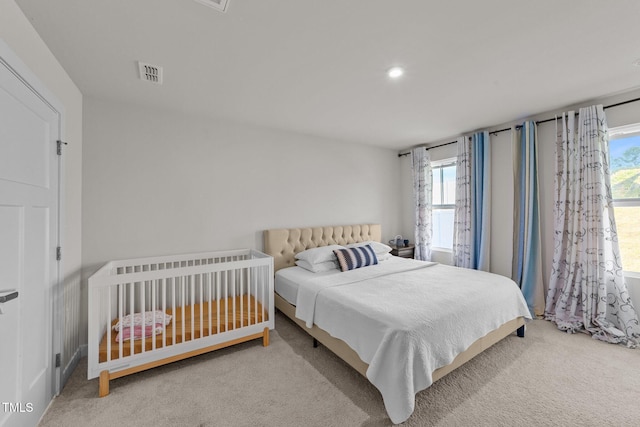 bedroom with multiple windows, carpet, and recessed lighting