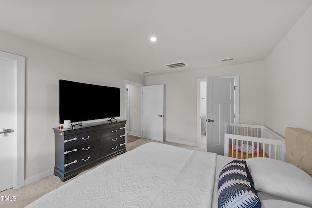 bedroom featuring baseboards and light carpet