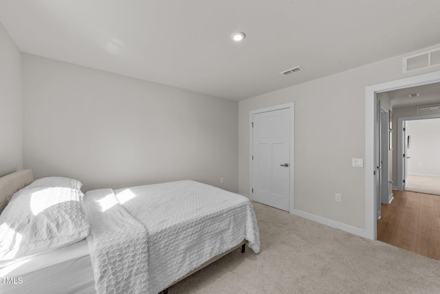 carpeted bedroom with baseboards