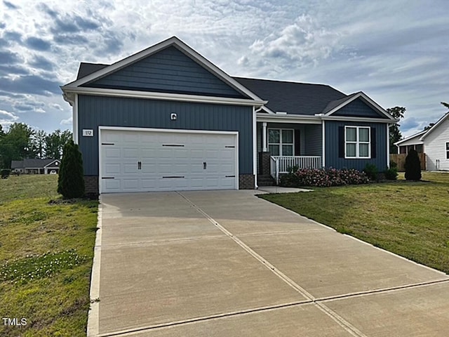 152 Springtooth Dr, Zebulon, NC 27597 - ranch-style house with a porch, a front lawn, an attached garage, and concrete driveway