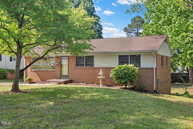 ranch-style home featuring brick siding
