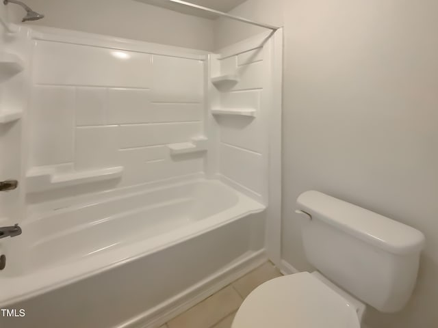 full bathroom featuring tile patterned floors, toilet, and shower / washtub combination