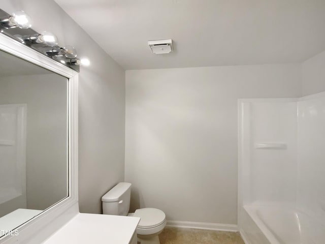 bathroom featuring toilet, vanity, tile patterned flooring, and baseboards