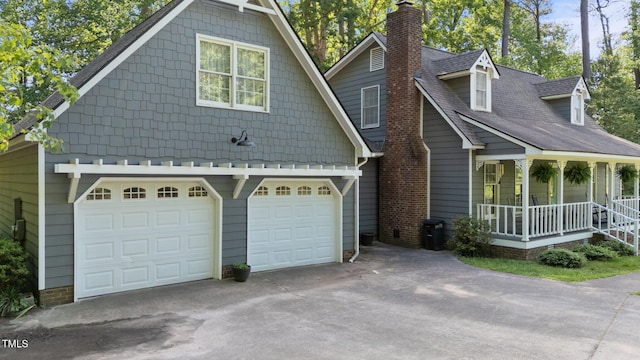6517 Hidden Pond Rd, Wendell, NC 27591 - view of front facade featuring a porch, a chimney, concrete driveway, and an attached garage