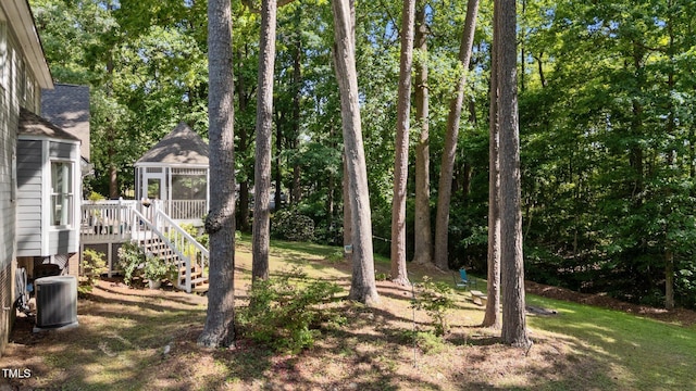 6517 Hidden Pond Rd, Wendell, NC 27591 - view of yard featuring central air condition unit, a deck, stairs, a gazebo, and view of scattered trees