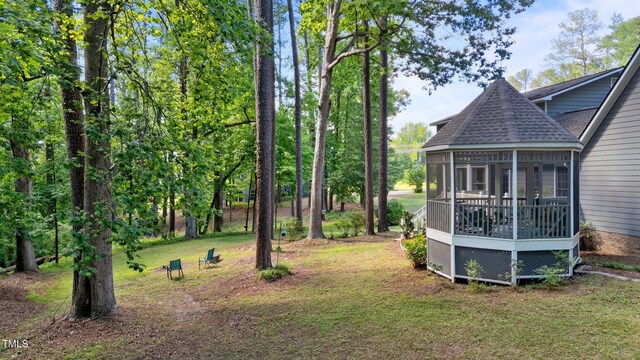 6517 Hidden Pond Rd, Wendell, NC 27591 - view of grassy yard with a sunroom