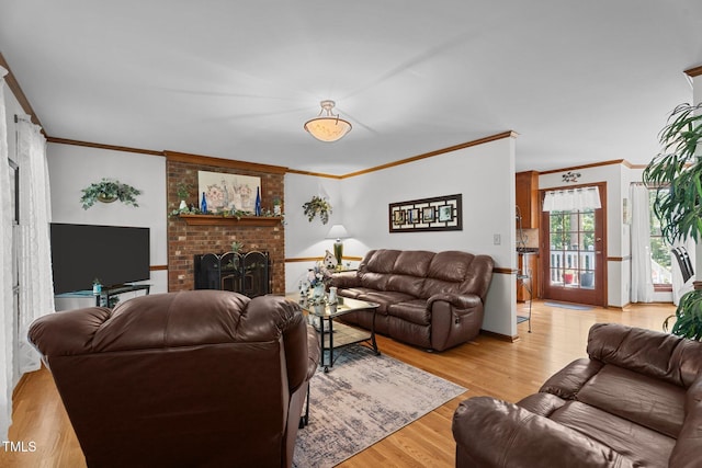 6517 Hidden Pond Rd, Wendell, NC 27591 - living room featuring ornamental molding, light wood-type flooring, and a brick fireplace