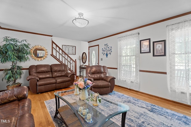 6517 Hidden Pond Rd, Wendell, NC 27591 - living room with wood finished floors, crown molding, and stairway