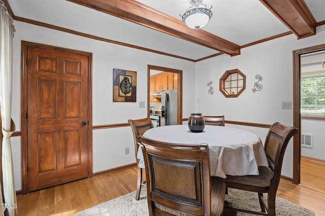 6517 Hidden Pond Rd, Wendell, NC 27591 - dining space featuring beamed ceiling, light wood-style flooring, and baseboards