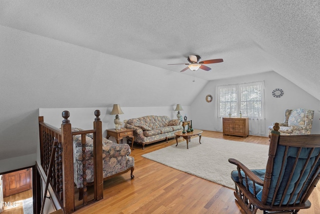 6517 Hidden Pond Rd, Wendell, NC 27591 - living area with lofted ceiling, ceiling fan, light wood-style floors, and a textured ceiling