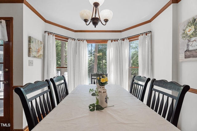 6517 Hidden Pond Rd, Wendell, NC 27591 - dining room featuring plenty of natural light, a chandelier, and crown molding
