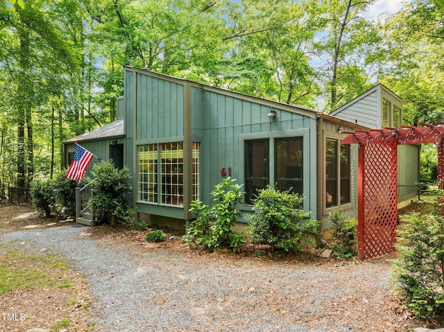 view of outbuilding featuring a pergola