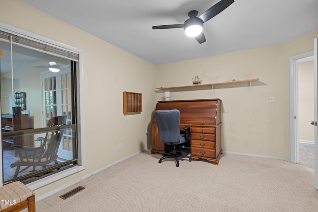 home office with a ceiling fan, carpet floors, and baseboards