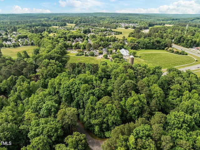 view of property location featuring a heavily wooded area