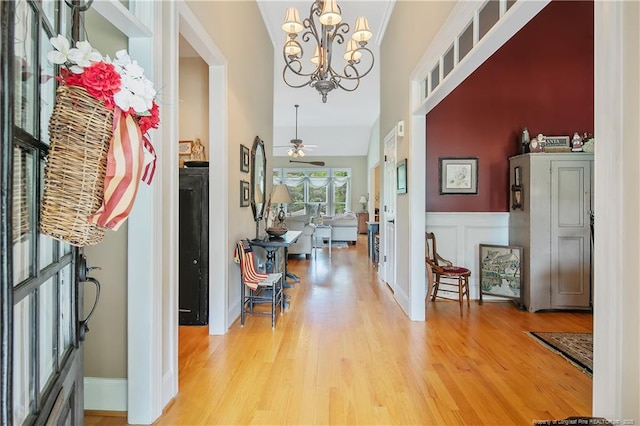 entrance foyer featuring a chandelier, wood finished floors, and ceiling fan