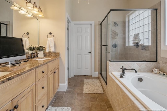 full bathroom with a shower stall, a garden tub, double vanity, and baseboards
