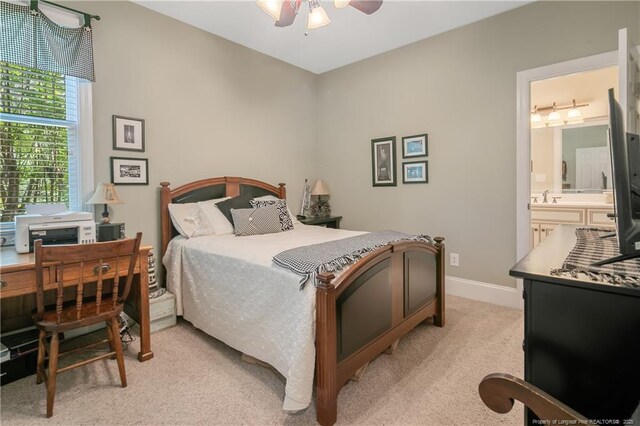 42 Skipping Water Dr, Spring Lake, NC 28390 - bedroom featuring light colored carpet, a sink, ensuite bathroom, baseboards, and a ceiling fan