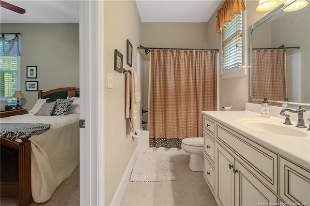 full bathroom featuring toilet, vanity, tile patterned flooring, shower / tub combo with curtain, and ceiling fan