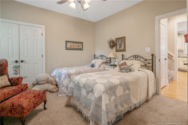 bedroom featuring carpet, a closet, and ceiling fan